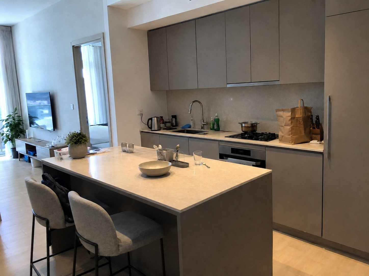 AI-generated kitchen with crowded worktops, mixed lighting and tilted framing